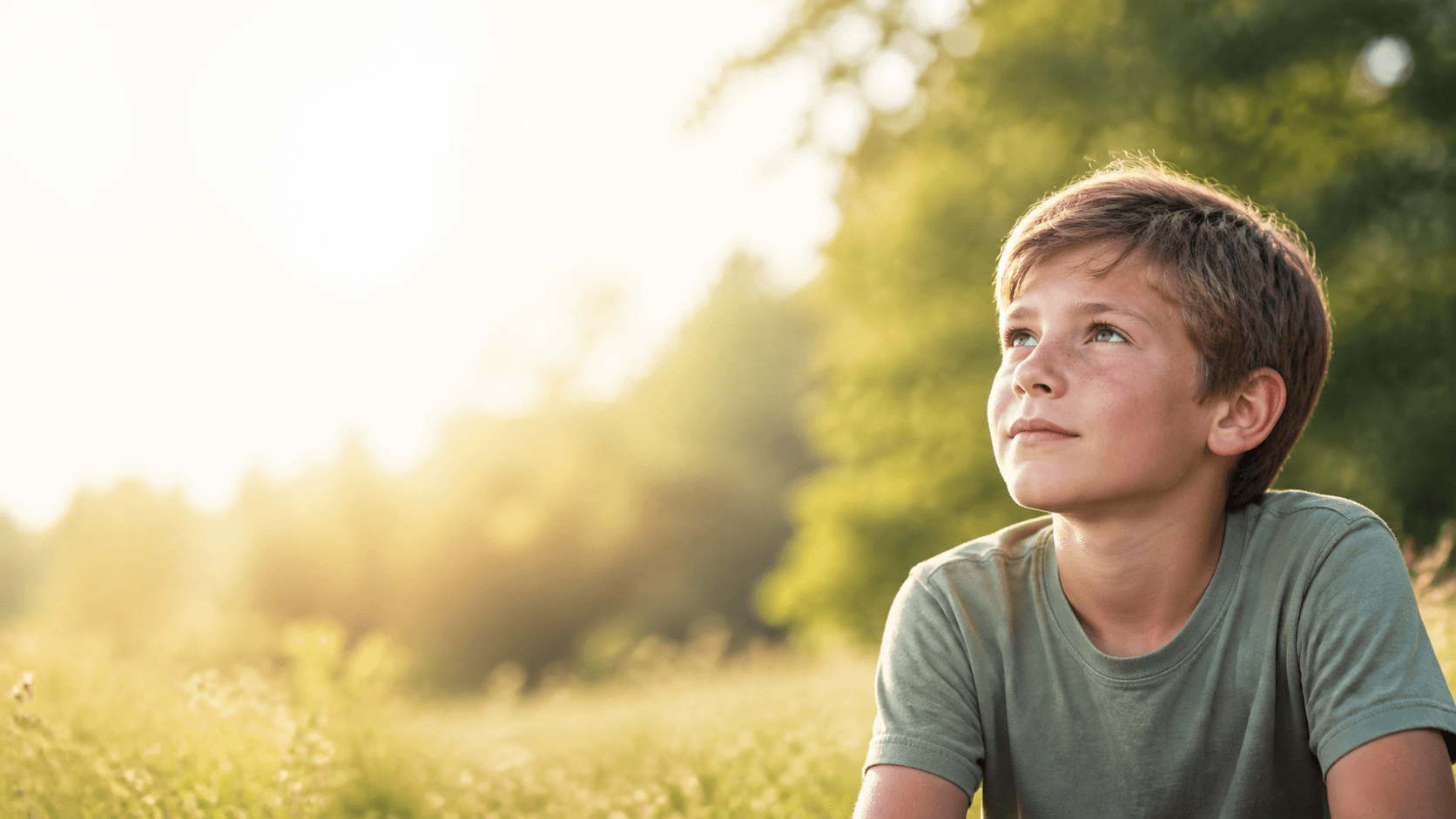 A child reflecting outdoors in warm morning light
